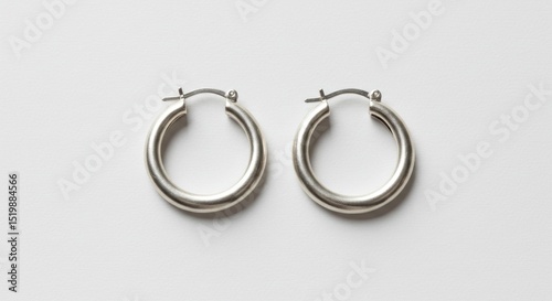 Pair of simple, brushed silver hoop earrings