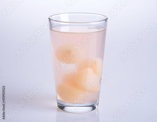 Wallpaper Mural Refreshing glass of lychee juice with whole lychees inside. Minimalist and clean presentation perfect for food, beverage, or tropical fruit-related concepts. Torontodigital.ca