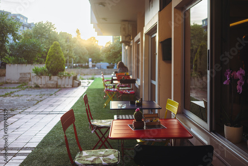 Fototapeta Naklejka Na Ścianę i Meble -  A small cafe on the ground floor of the building