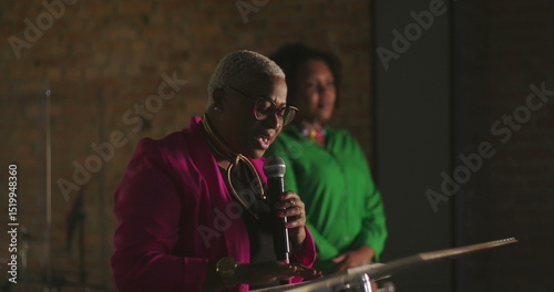 Tableau sur toile African descent woman preaching passionately during evangelical church gathering