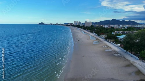Natural coastline with clear ocean and blue sky