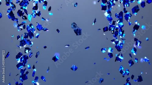 Shiny blue confetti is falling against a light grey background with light rays passing through, creating a celebratory and festive atmosphere
