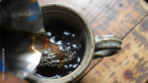 Steaming Hot Coffee Poured into Cup in Morning Light