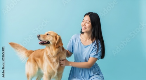 Joyful moment with a woman and her golden retriever in a serene setting