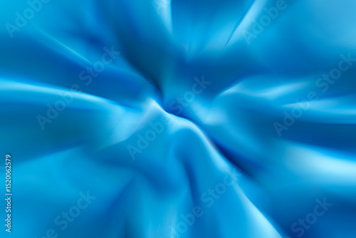 Close-up of blue fabric texture with soft folds and flowing design