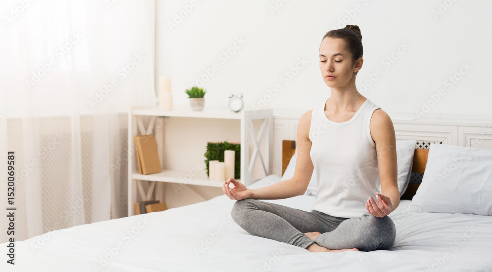 Morning Meditation. Woman Practising Yoga In The Morning, Sitting On Bed, Free Space Morning Meditation. Woman Practising Yoga In The Morning, Sitting On Bed, Free Space
