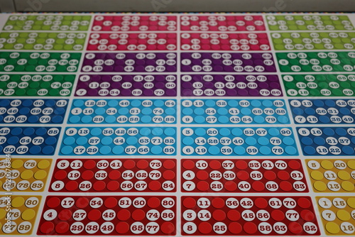printing of colored and numbered game cards called bingo in the printing house. selective focus