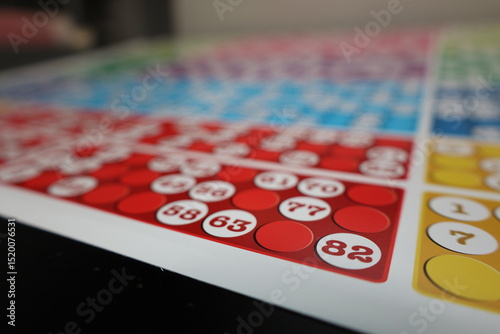 printing of colored and numbered game cards called bingo in the printing house. selective focus
