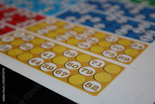 printing of colored and numbered game cards called bingo in the printing house. selective focus