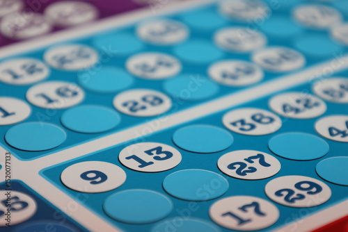 printing of colored and numbered game cards called bingo in the printing house. selective focus
