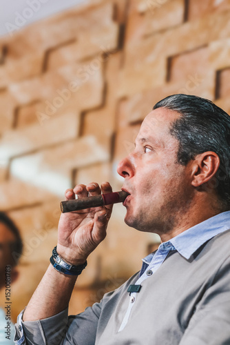 Entrepreneur enjoying a cigar during a business conference