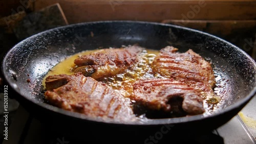 Frying fish on a frying pan. black and old frying pan. Fish frying in oil