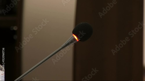 Black slim microphone with illuminated head