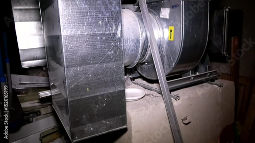 Large metal ventilation pipes in the basement