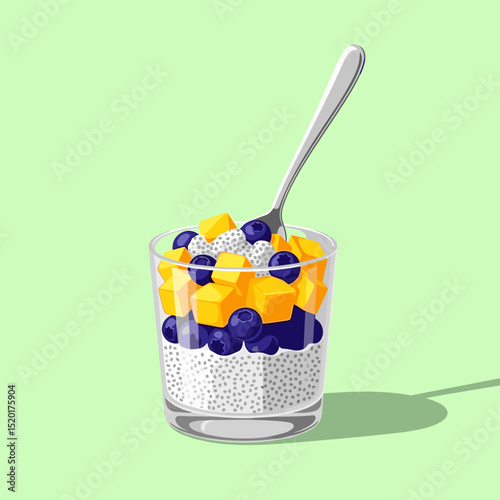 Chia pudding with mango and blueberries in glass cup