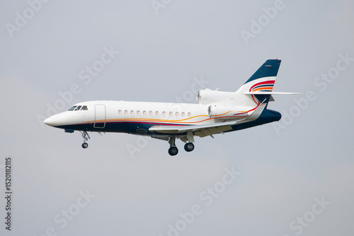 Executive Business Jet Falcon 2000 Approaching, Clear Blue Sky