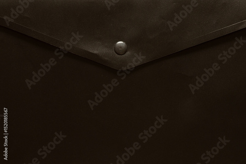 Black business folder with a button as a background for business themes, documents