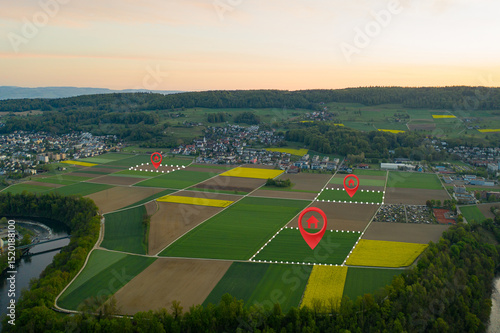 Obraz na płótnie Land plot management - real estate concept with a vacant land on a green field available for building construction and housing subdivision in a residential area for sale, rent, buy or investment