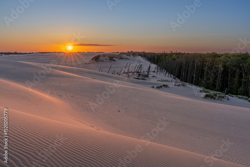 Serene Sunset Over Sandy Landscape