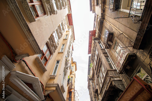 Fototapeta Naklejka Na Ścianę i Meble -  Old buildings in the street of Beyoğlu district in Istanbul city