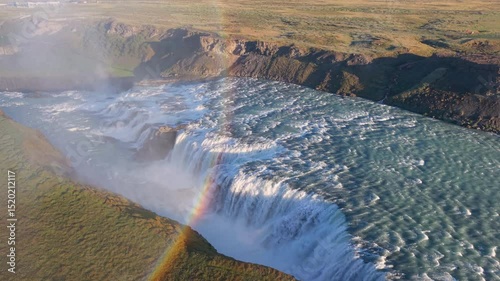 Aerial Views of a Majestic and Breathtaking Waterfall Gullfoss Accompanied by a Rainbow. Iceland. 