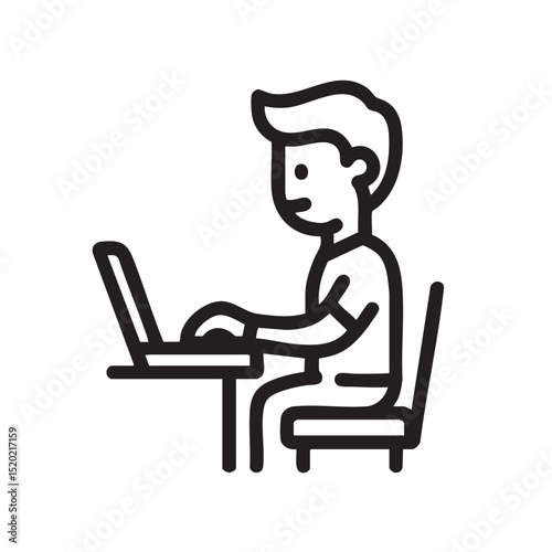 Young boy working on laptop at desk during study time