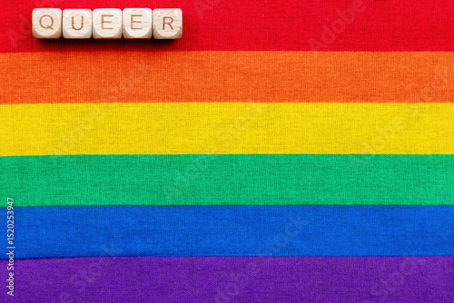 Queer identity celebration on rainbow pride flag background