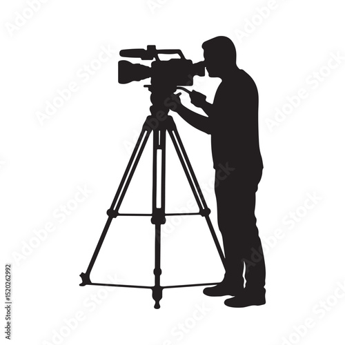 A cameraman operating a professional video camera on a tripod