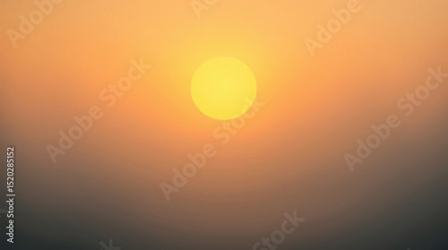 Golden sun setting in a hazy sky, creating a serene and tranquil atmosphere.