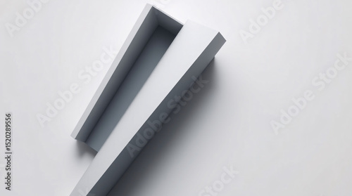 A black and white abstract image with geometric shapes and sharp shadows.