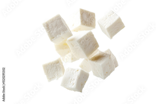 Floating cubes of fresh white paneer cheese on black background, cut out