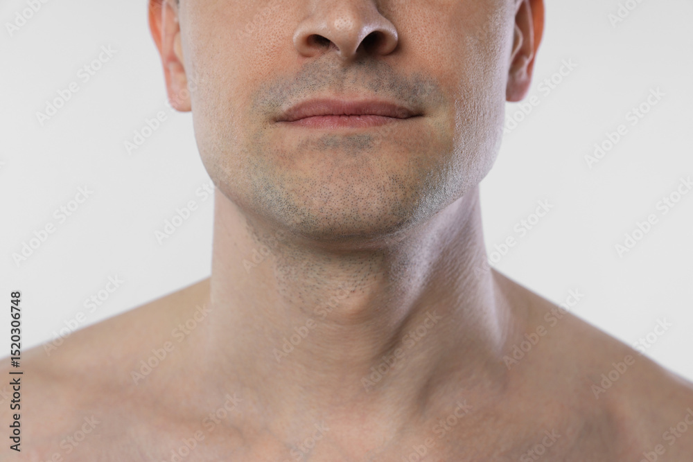 Obraz premium Man after shaving on white background, closeup