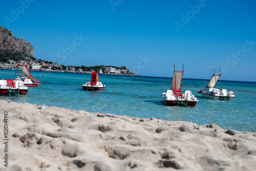 Fototapeta Naklejka Na Ścianę i Meble -  Sunny day on seaside vacation destination, Mondello Beach, near Palermo in Sicily with fine, golden sand, turquoise waters and charming villas, South of Italy