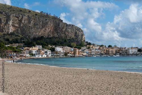 Fototapeta Naklejka Na Ścianę i Meble -  Stormy weather on seaside vacation destination, Mondello Beach, near Palermo in Sicily with fine, golden sand, turquoise waters and charming villas, South of Italy