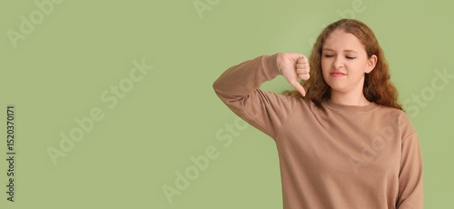 Young woman showing dislike...