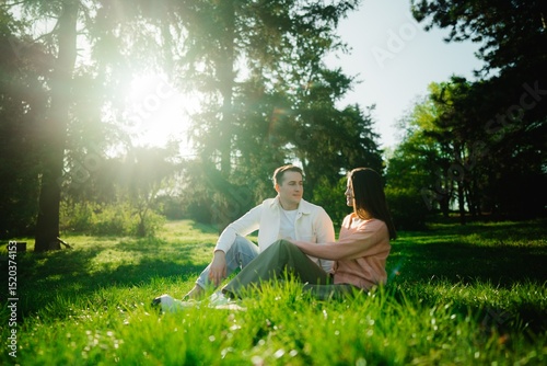 Couple enjoys a serene afternoon together in a sunlit forest clearing