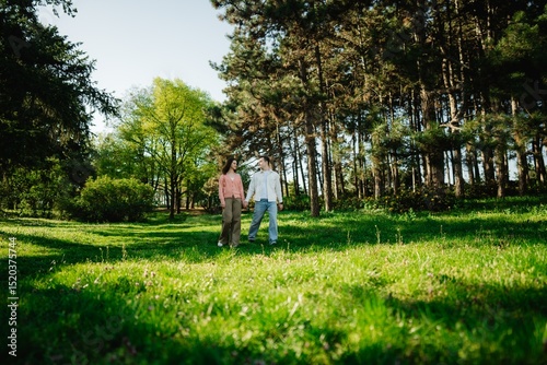 Exploring nature together in a serene forest during a sunny day