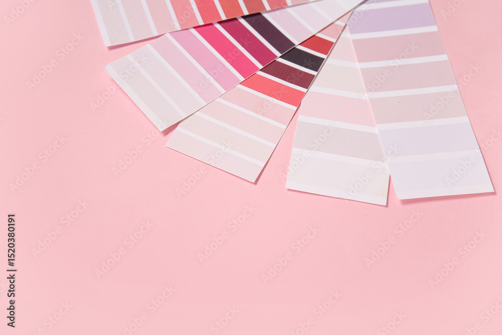 Naklejka premium Many color palettes on pink background