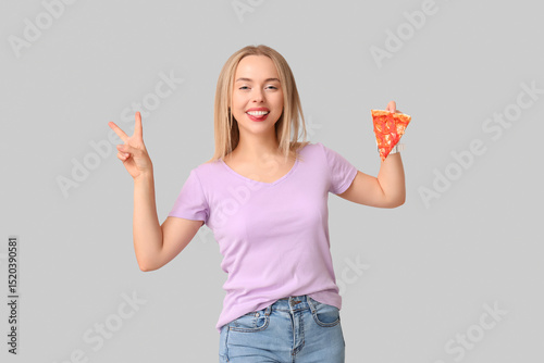 Young woman holding piece o...