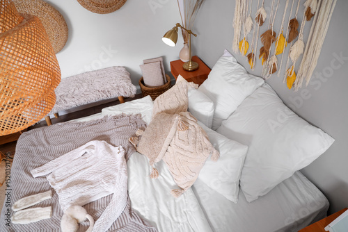 Bed with pillows, blankets ...
