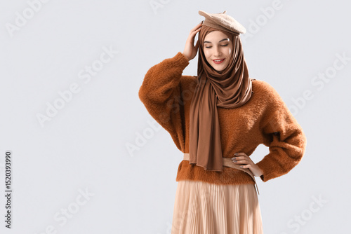 Stylish Muslim woman on gre...