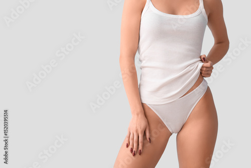 Young woman in white underw...