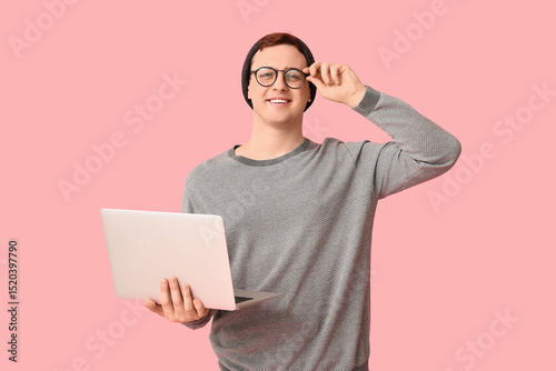 Smiling young man in beanie...