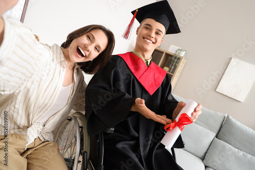Male graduate in wheelchair...