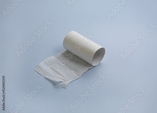 Finished roll of toilet paper on grey background. Diarrhea or digestive disorder concept. Selective focus, copy space