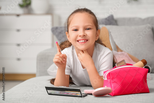 Cute little girl with cosme...