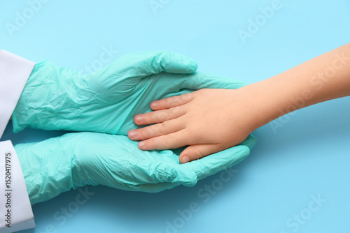 Doctor's and child's hands ...