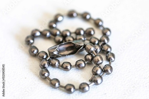 Small metal chain with balls and ingenious clasp