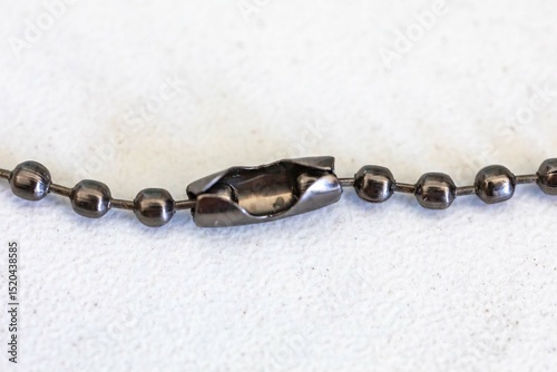 Small metal chain with balls and ingenious clasp