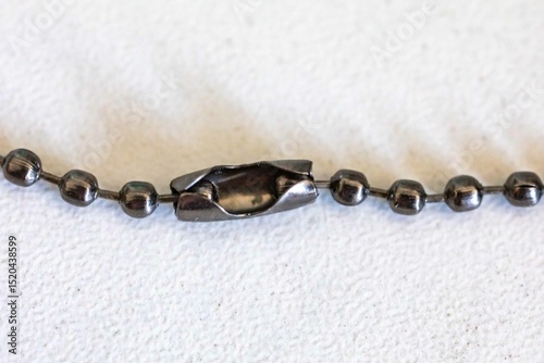 Small metal chain with balls and ingenious clasp